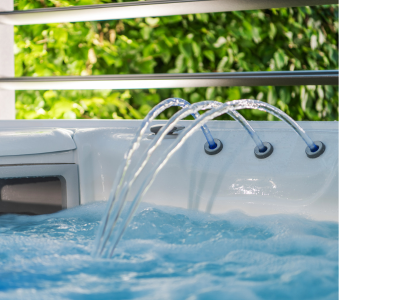 Water circulates in a swim spa. The water feature is turned on and featured in this image.