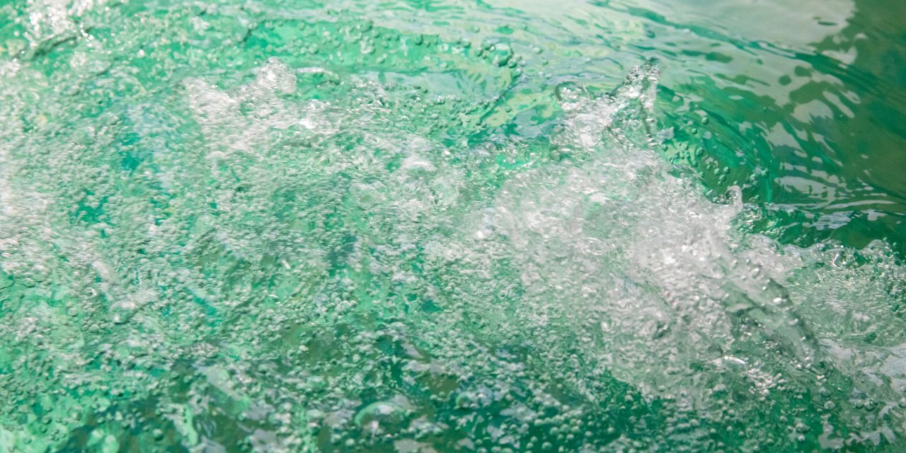 Closeup shot of green hot tub water