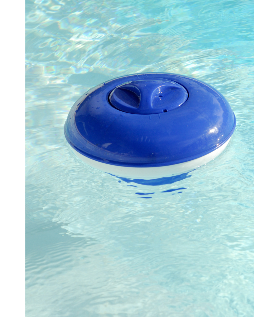 A blue and white chlorinator floats in a hot tub